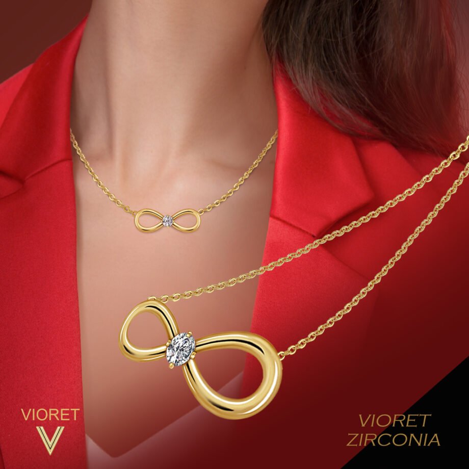 Mujer vestida de rojo luciedo el Colgante Oro Infinity diseñado por Vioret Joyas ®